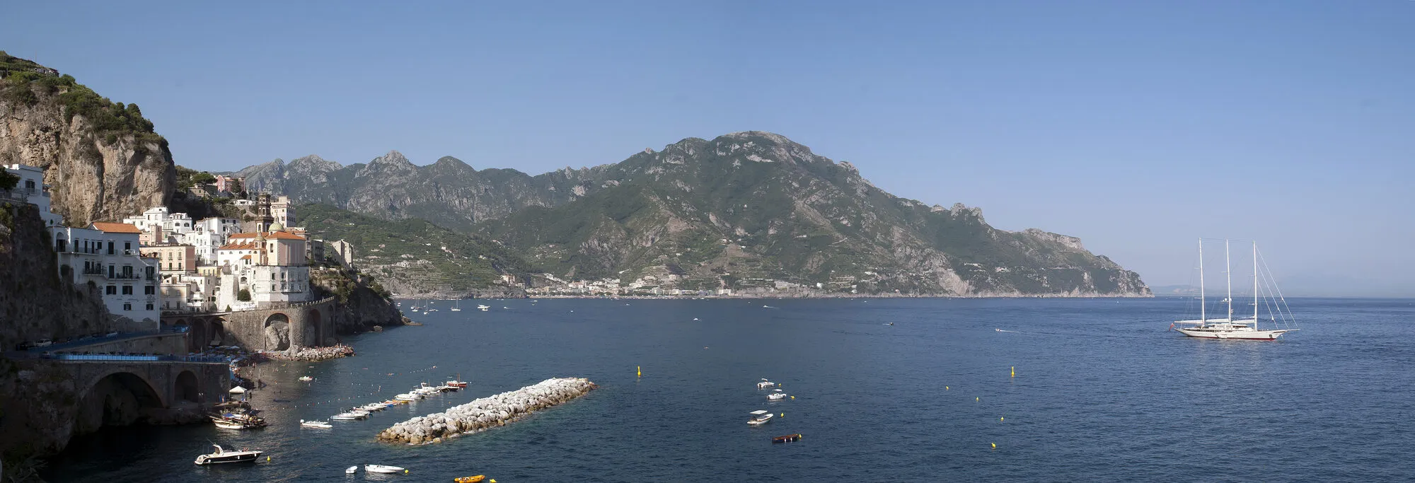 Atrani and the Amalfi Coast seen from the sea, with cliffs dropping into blue water