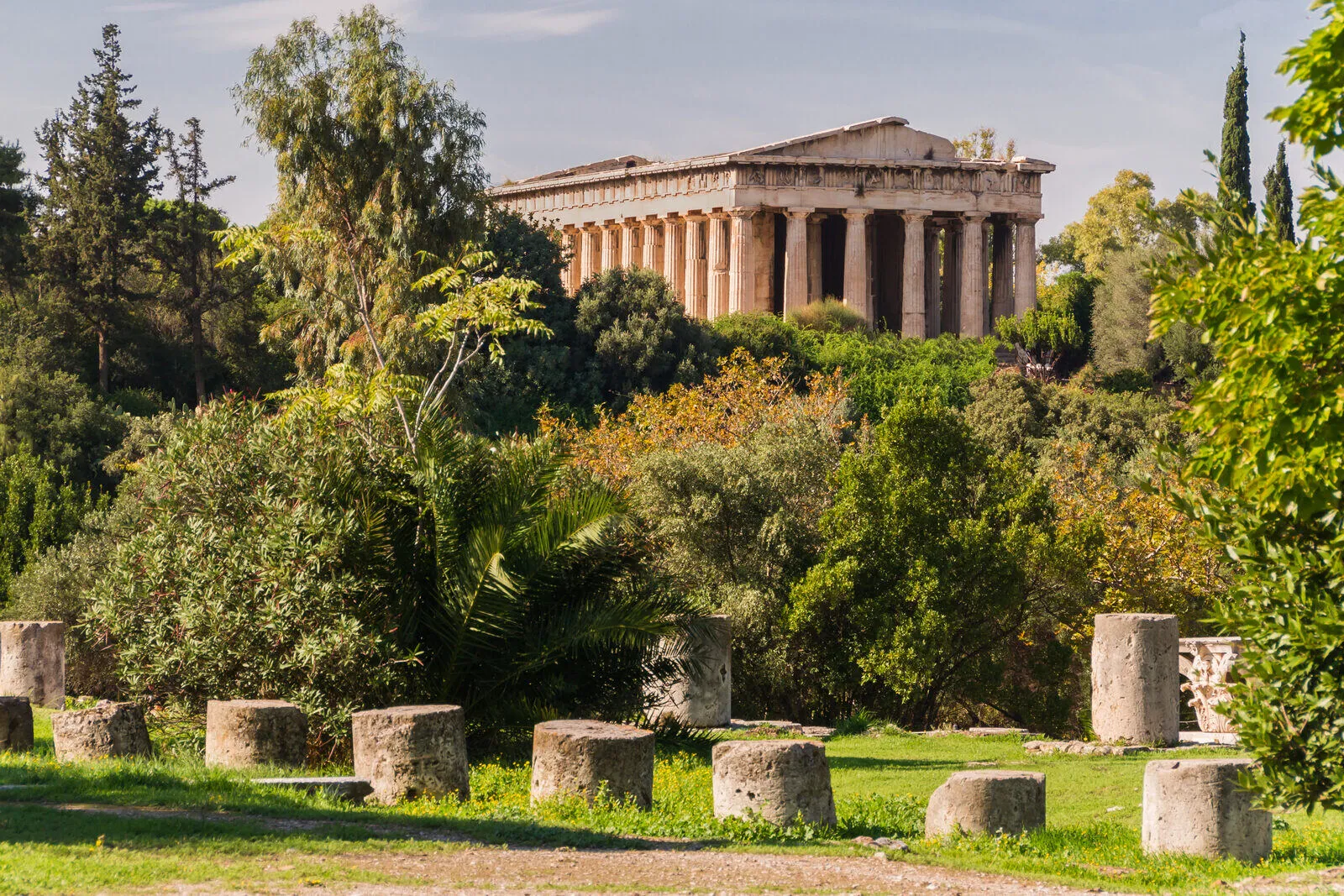 The Temple of Hephaestus standing among trees in the Ancient Agora of Athens