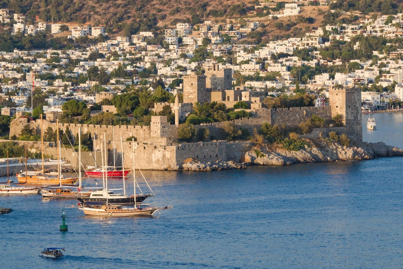 The towers and walls of Bodrum Castle above the harbour in Bodrum, Turkey