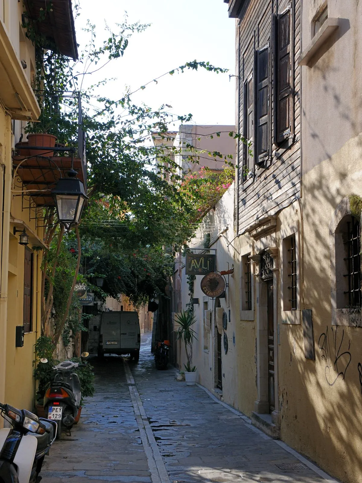 A flower-filled narrow street in the Venetian old town of Rethymno, Crete