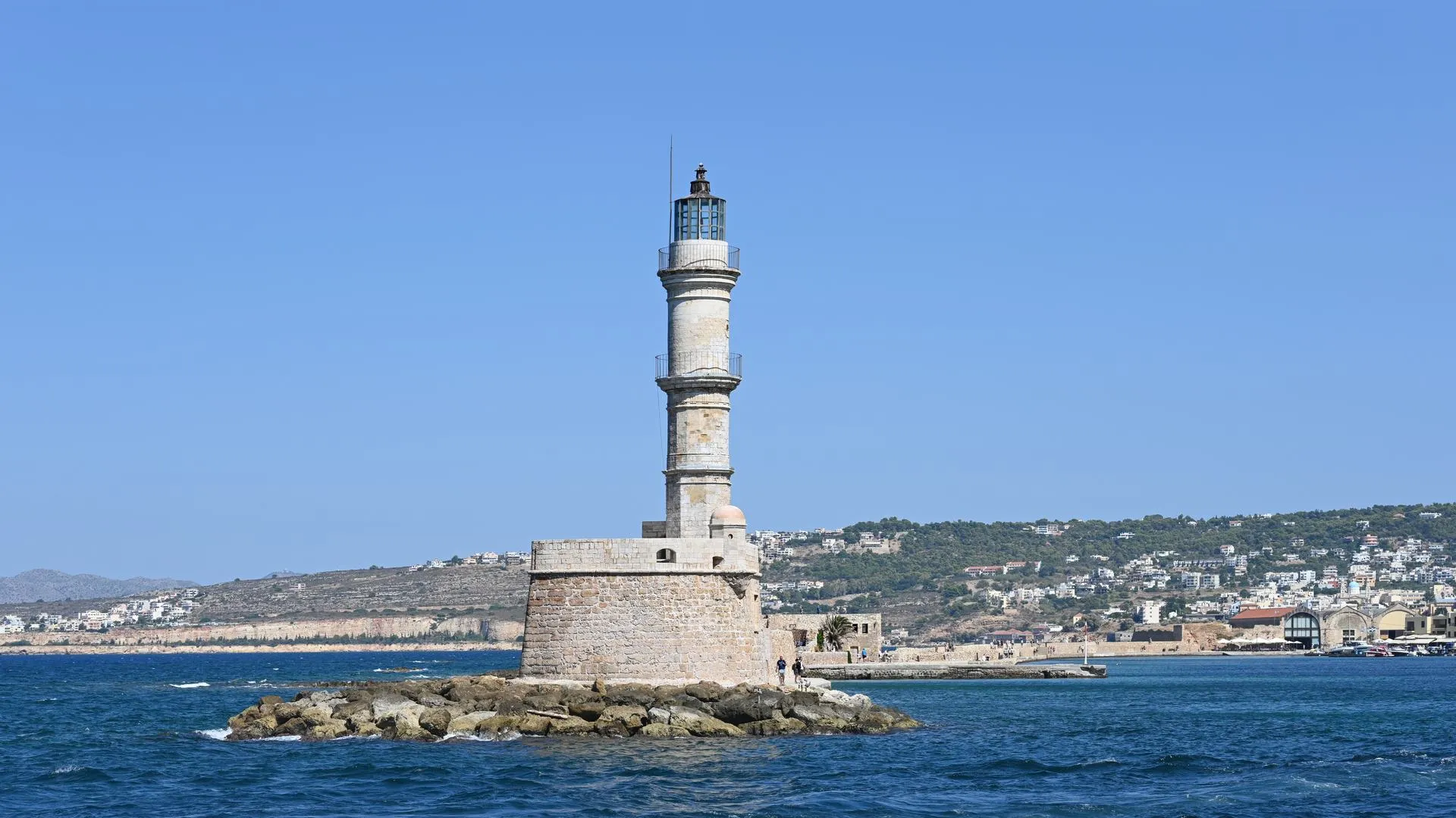 The Venetian lighthouse and old harbour of Chania on the north coast of Crete, Greece