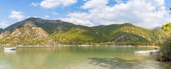 The Blue Lagoon at Oludeniz on Turkey's Turquoise Coast, with turquoise water and green headlands