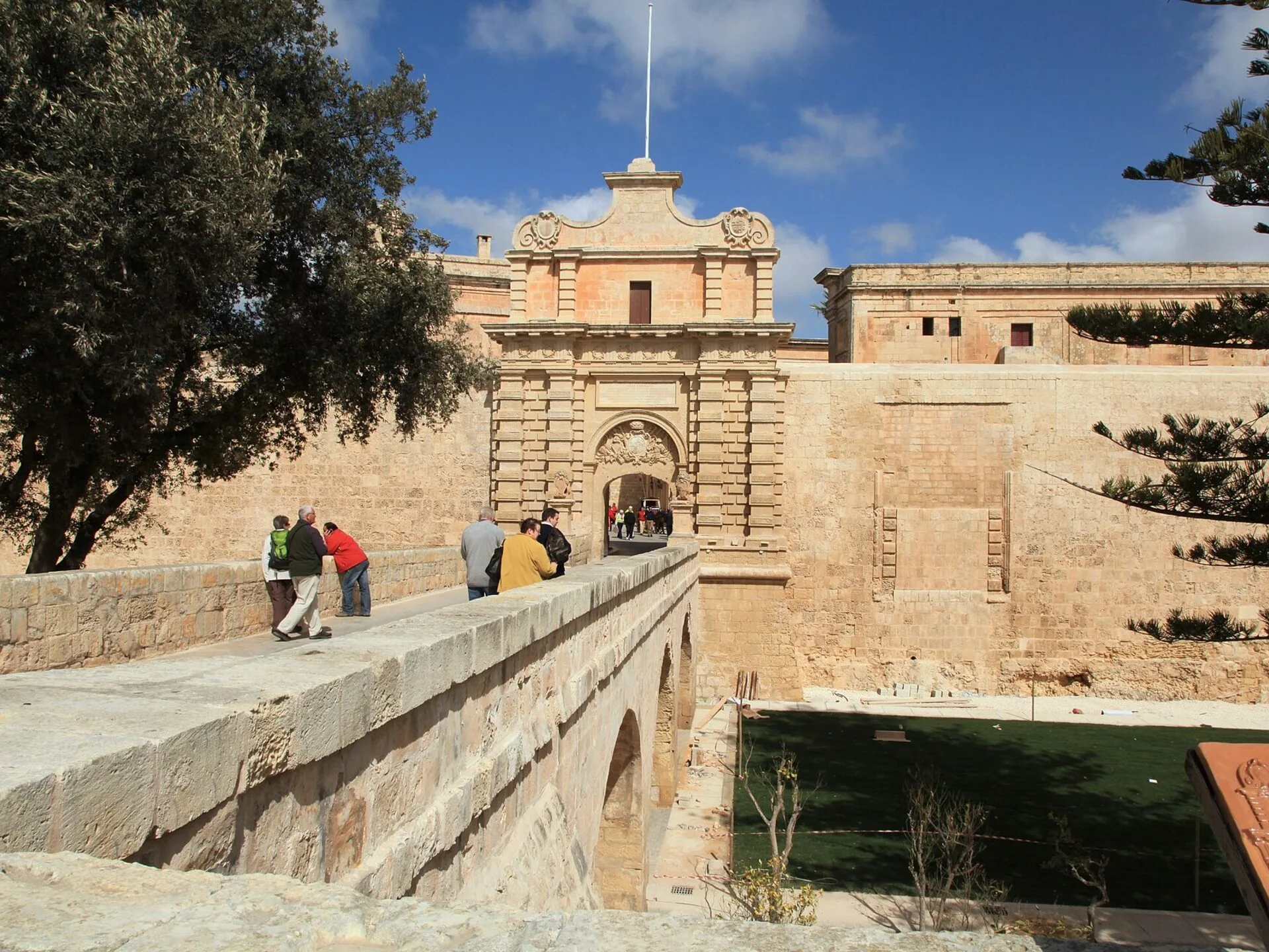 The Baroque Main Gate and stone bridge of Mdina, Malta, under a blue sky