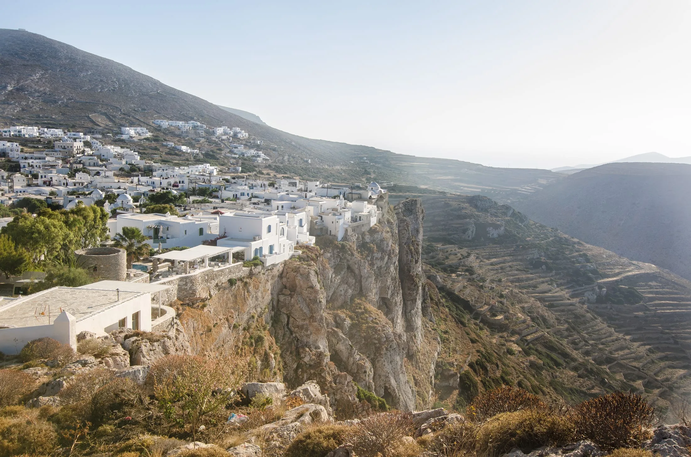 The whitewashed hilltop village of Chora on Folegandros, one of the quiet Greek islands