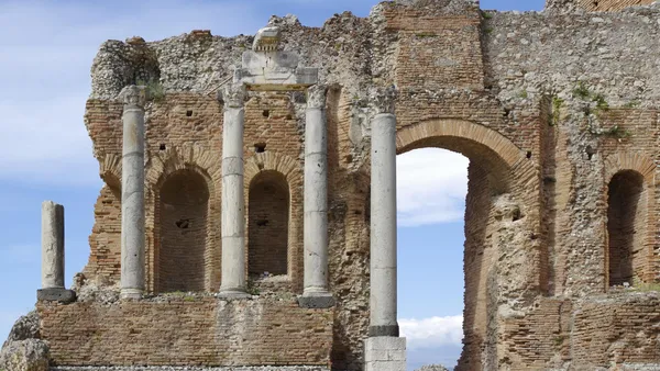 The Greek theatre of Taormina with Mount Etna rising behind it, Sicily, Italy