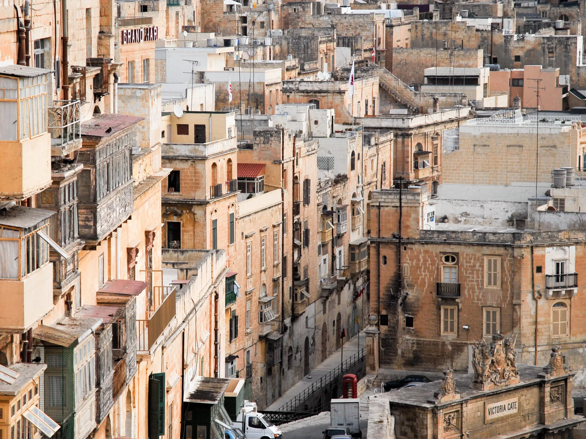 The honey-coloured rooftops, balconies and domes of Valletta, Malta, seen from above