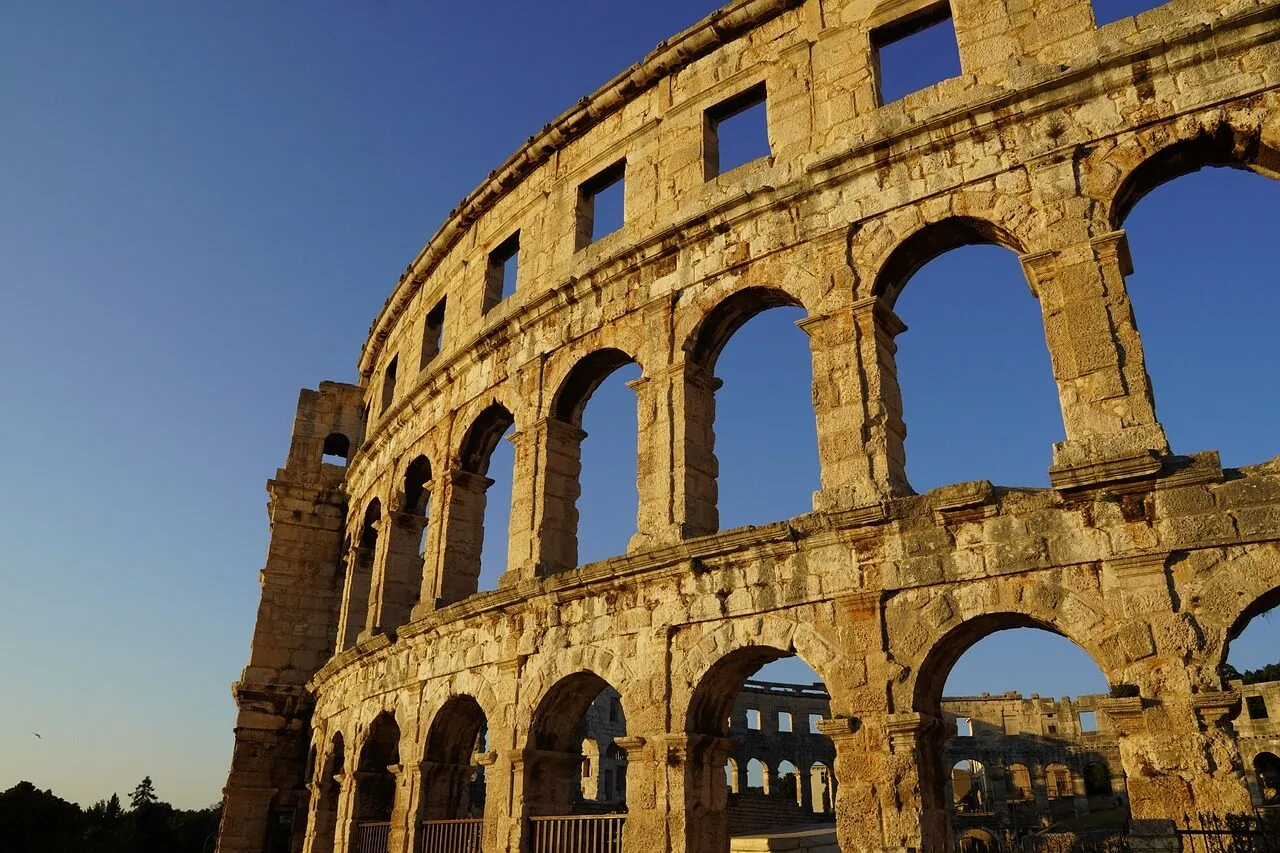 The Roman amphitheatre of Pula in Croatia, its ancient stone arches rising above the town