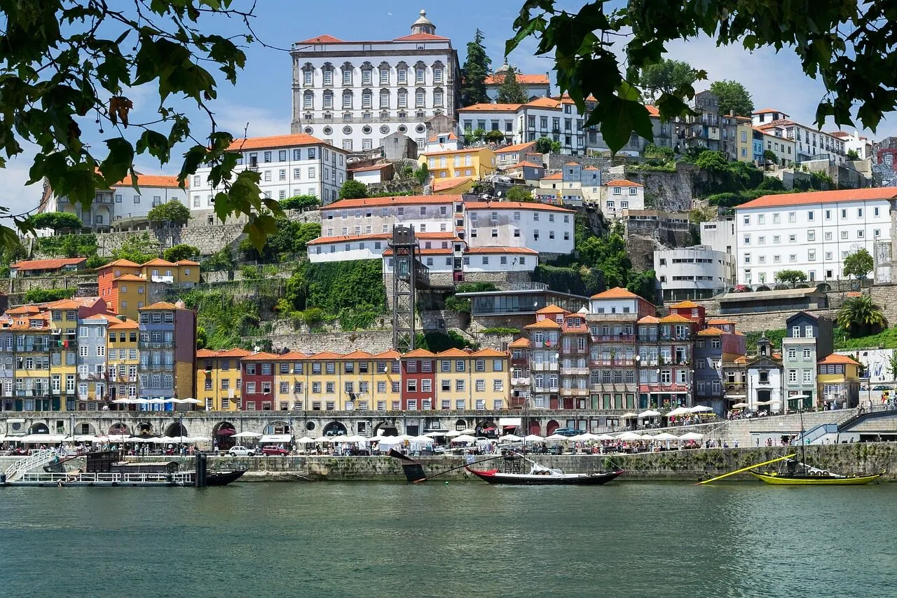 Colourful Ribeira houses and rabelo boats on the Douro river in Porto, Portugal