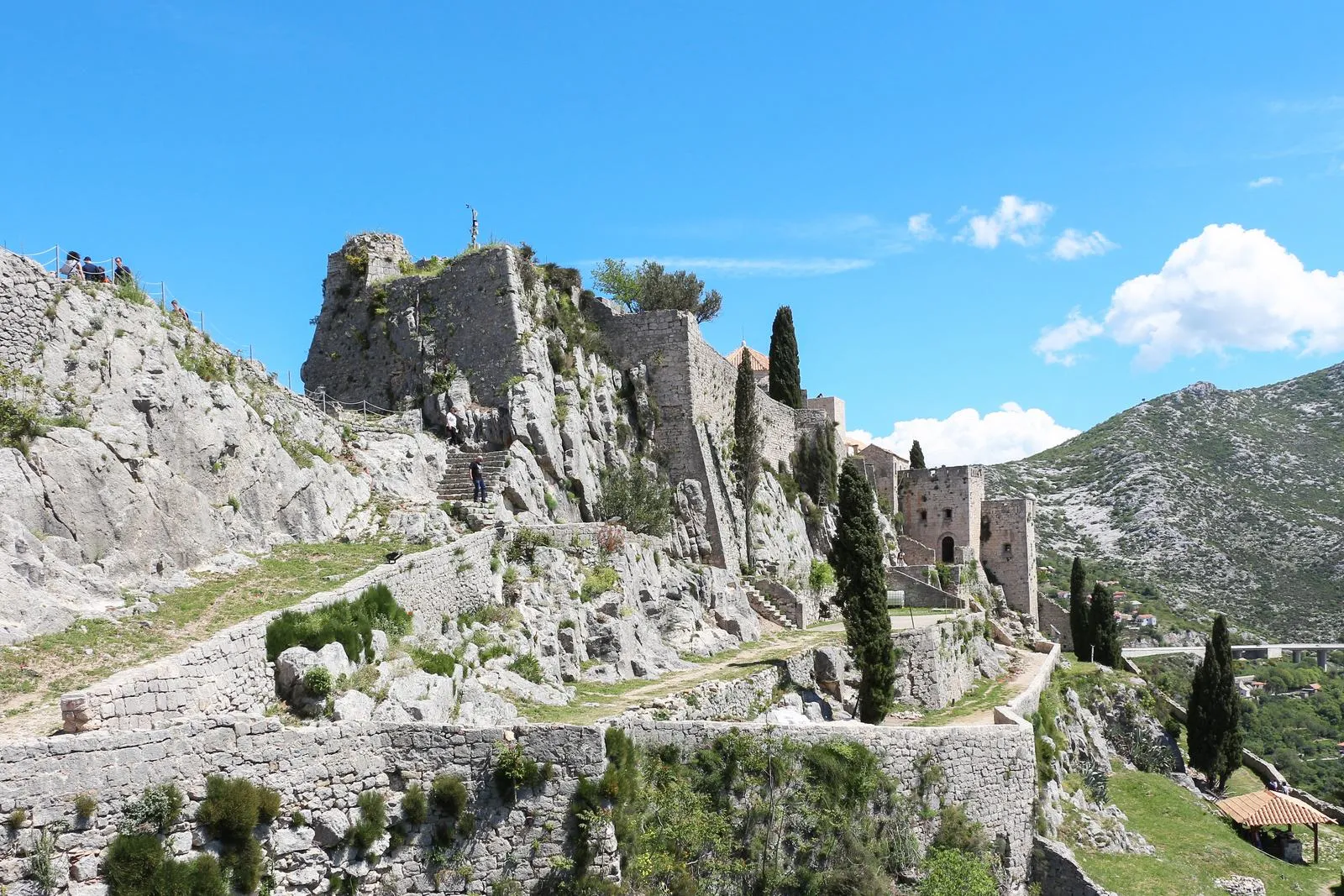 The layered stone walls of Klis Fortress above Split, Croatia